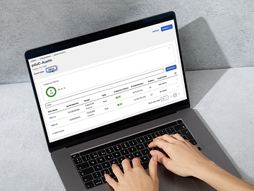 Data on laptop with hands visible typing 