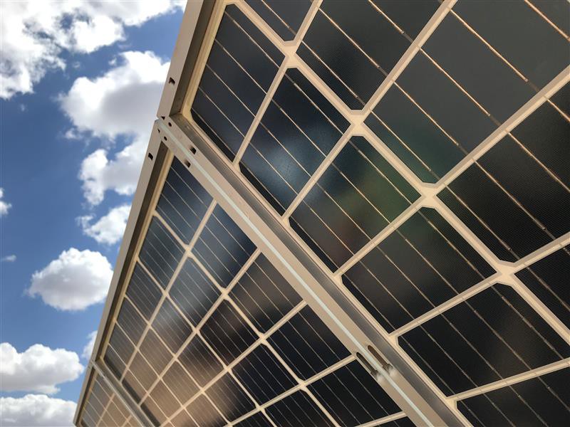 Solar panels in a solar farm, field.