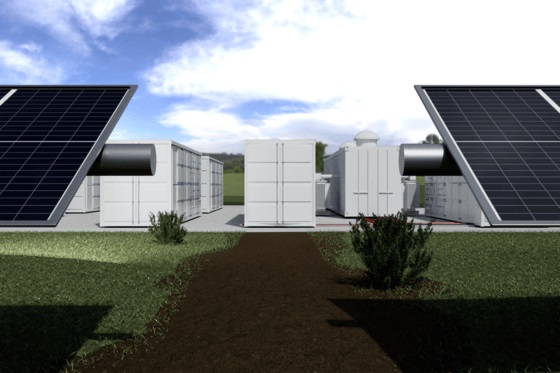 View of BESS installation at the edge of a solar farm